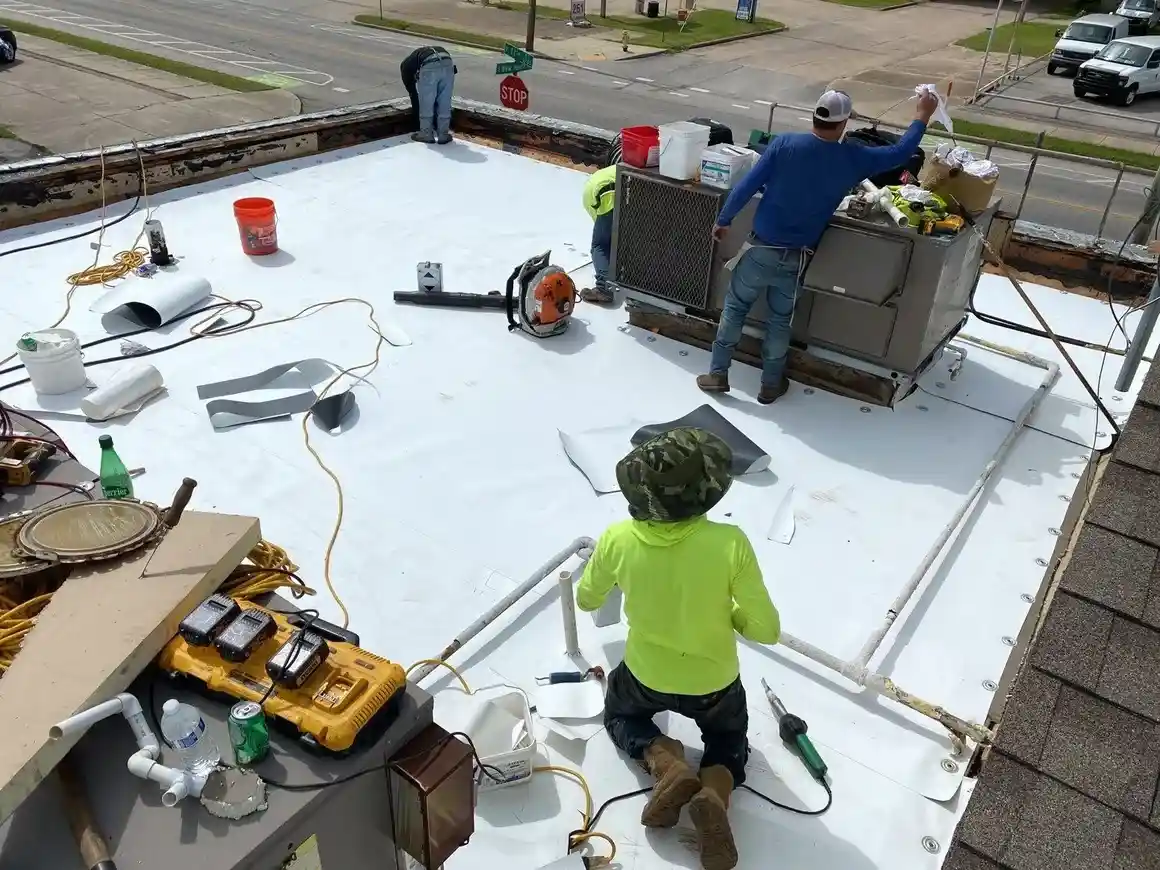 Roofers working on a flat roof