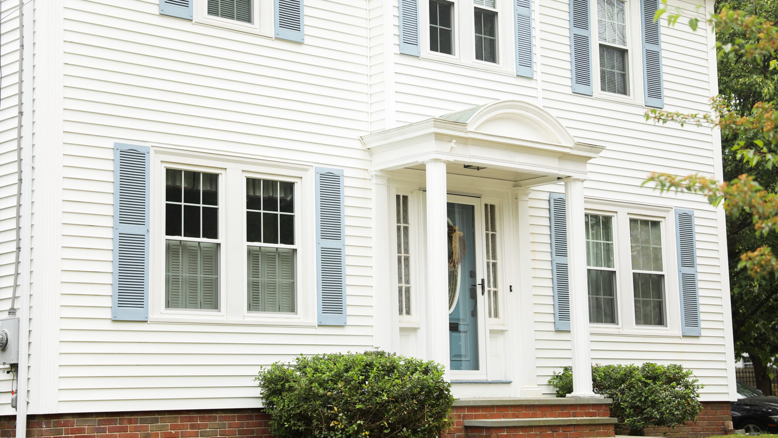 Large home exterior with beautiful white siding