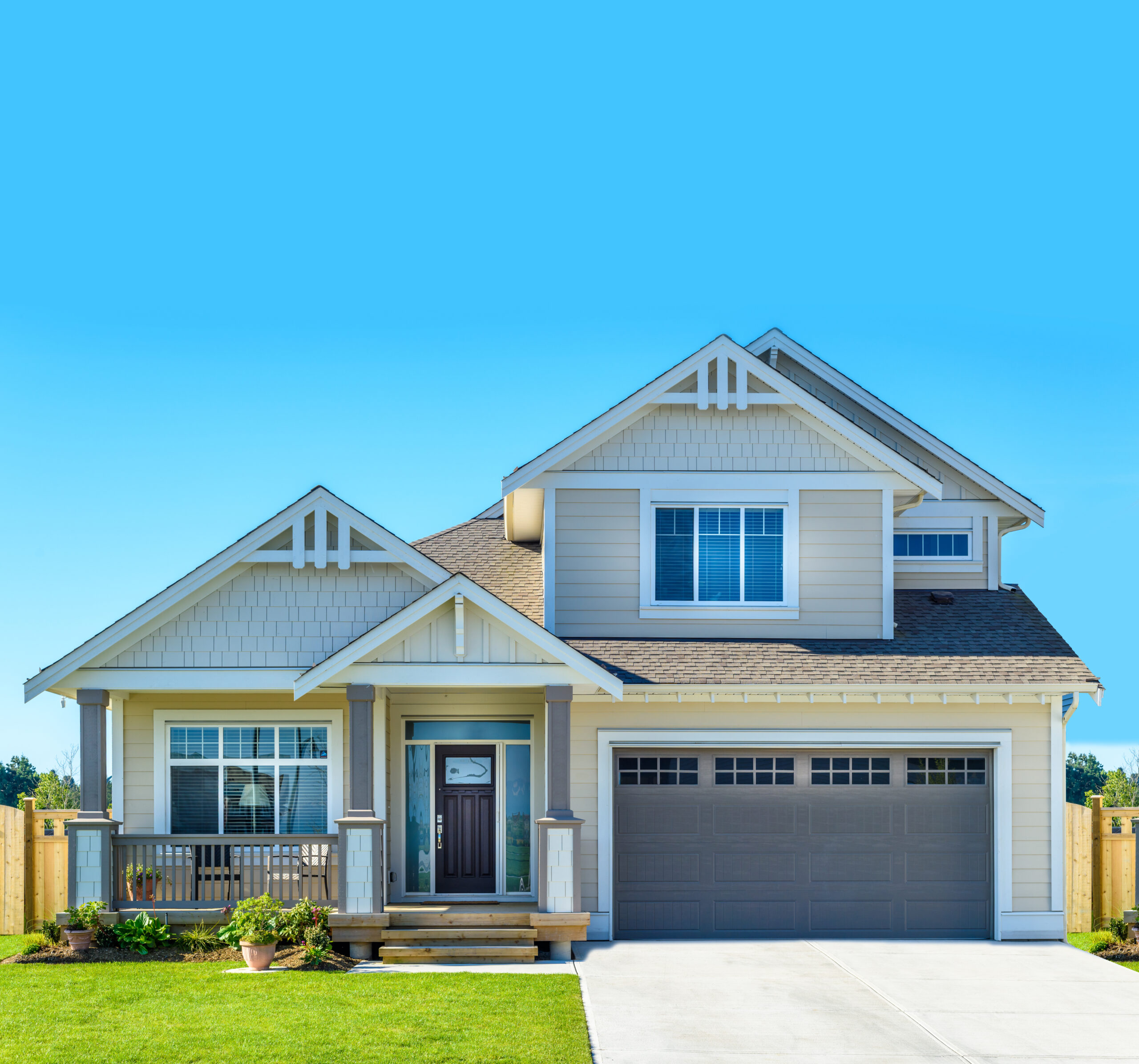 Two-story house with a dark door and garage