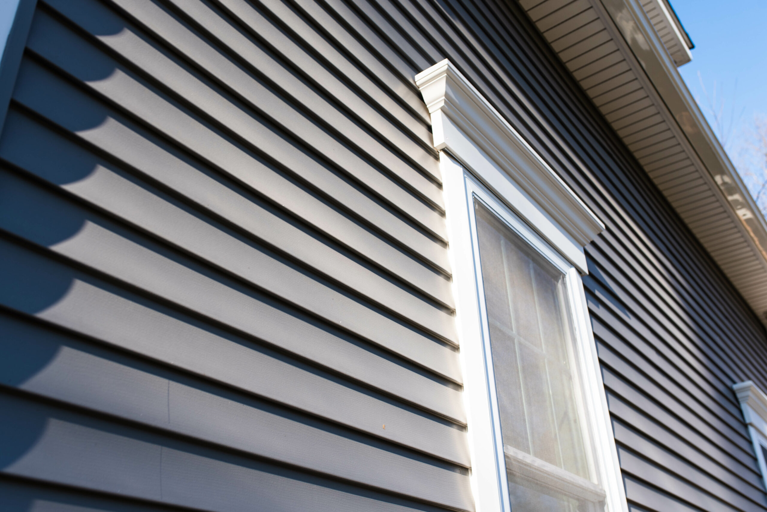 Dark siding on a house with a window