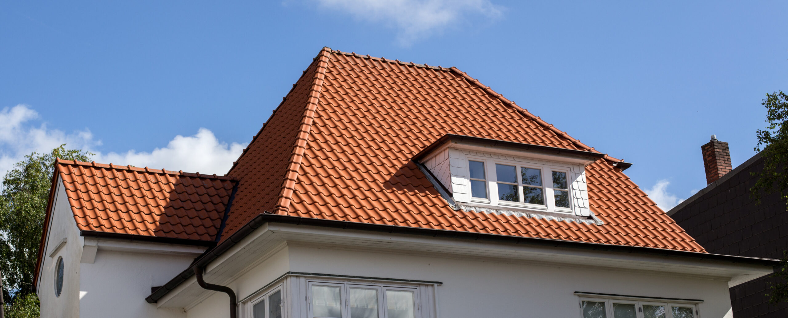 Red tile roof on a multi-story house