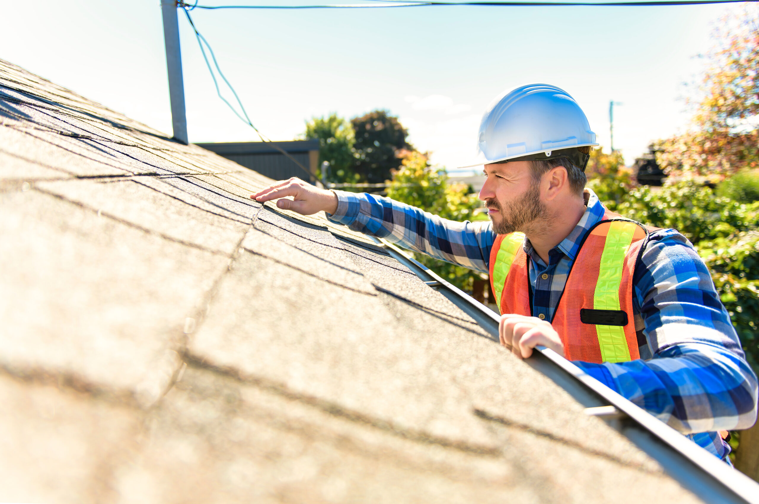 Inspector examining a residential roof