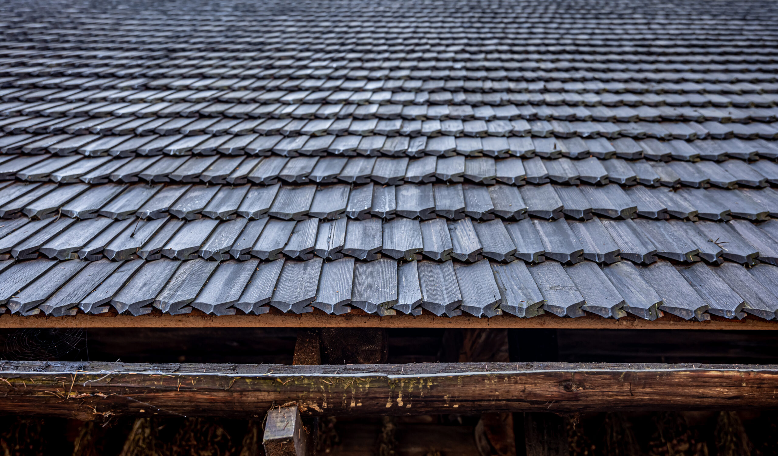 A close-up shot of a cedar shake roofing material on a home.
