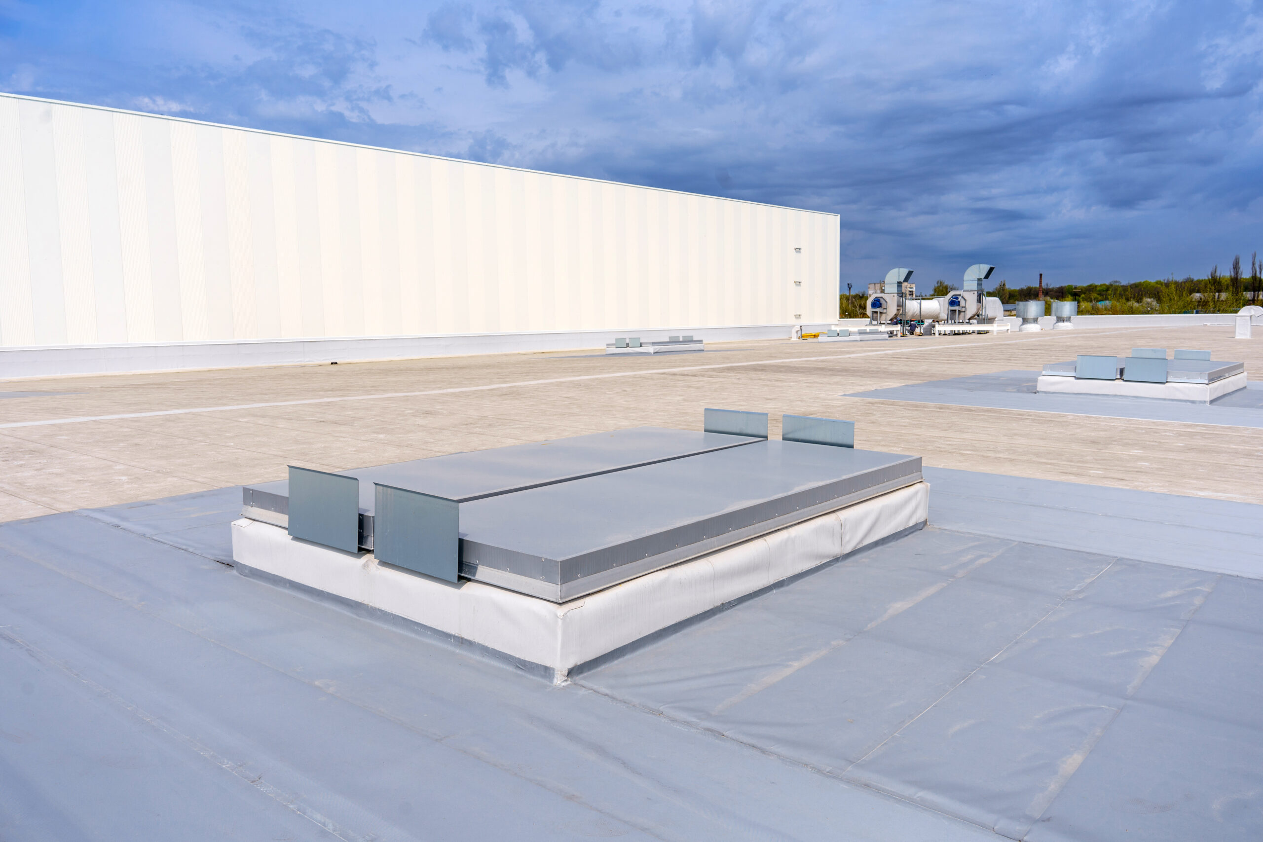 A newly installed flat commercial roof with crisp, clean lines.
