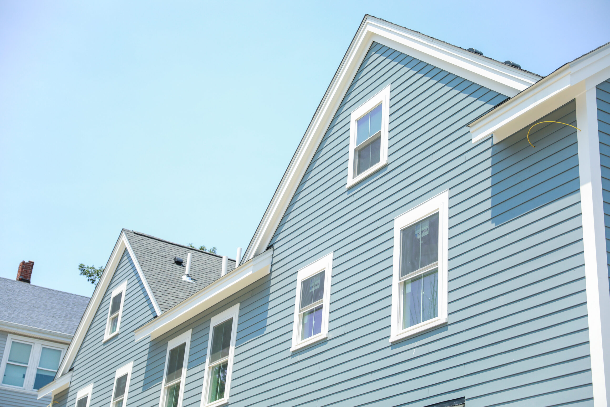 Blue siding on the side of a multi-story building