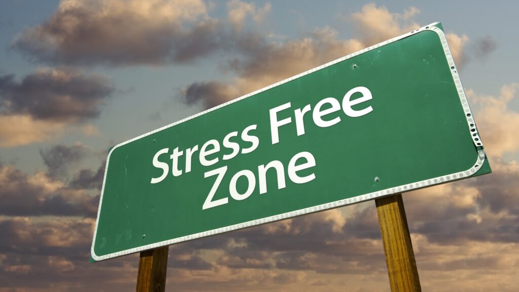 Stress Free Zone Green Road Sign and Clouds