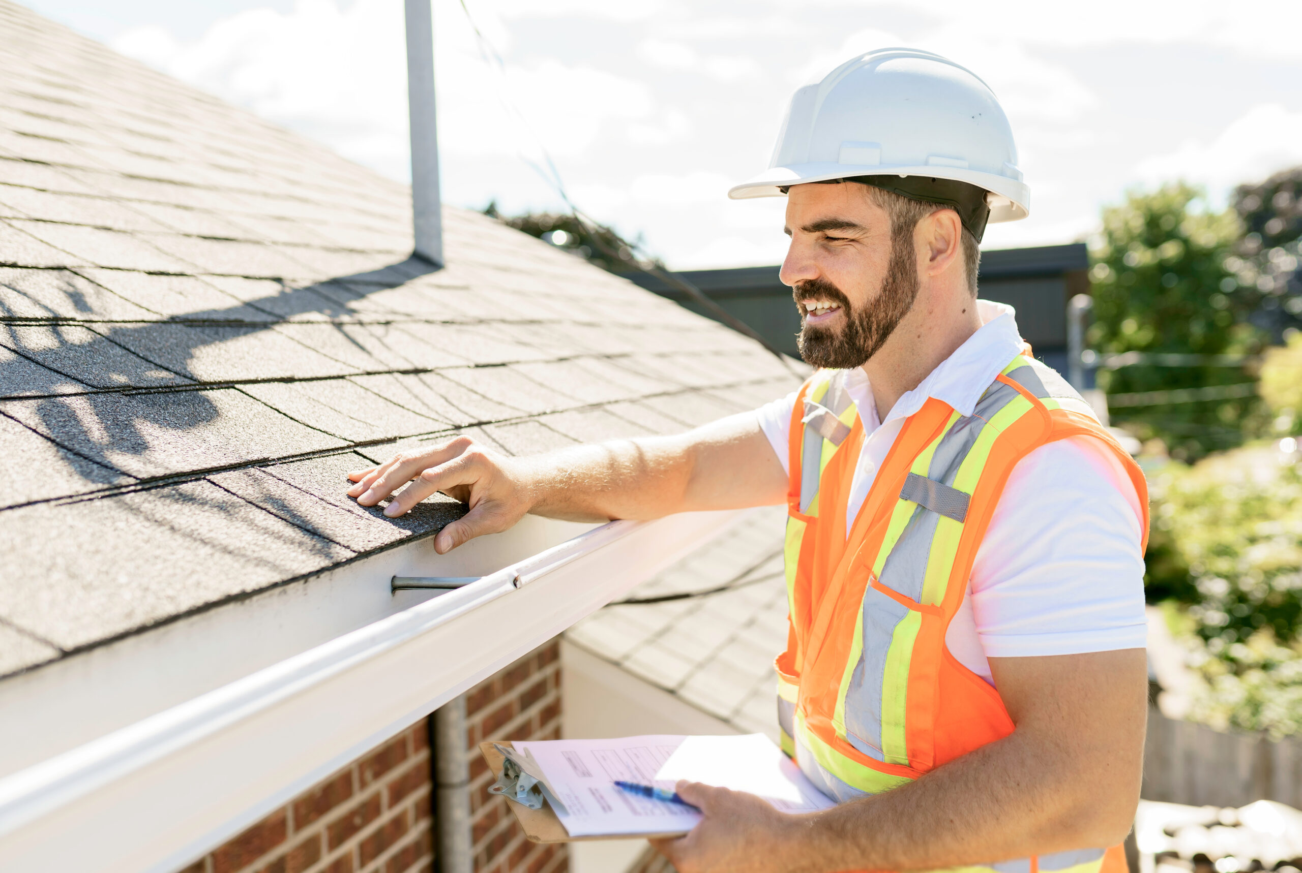 Inspector looking at a residential roof