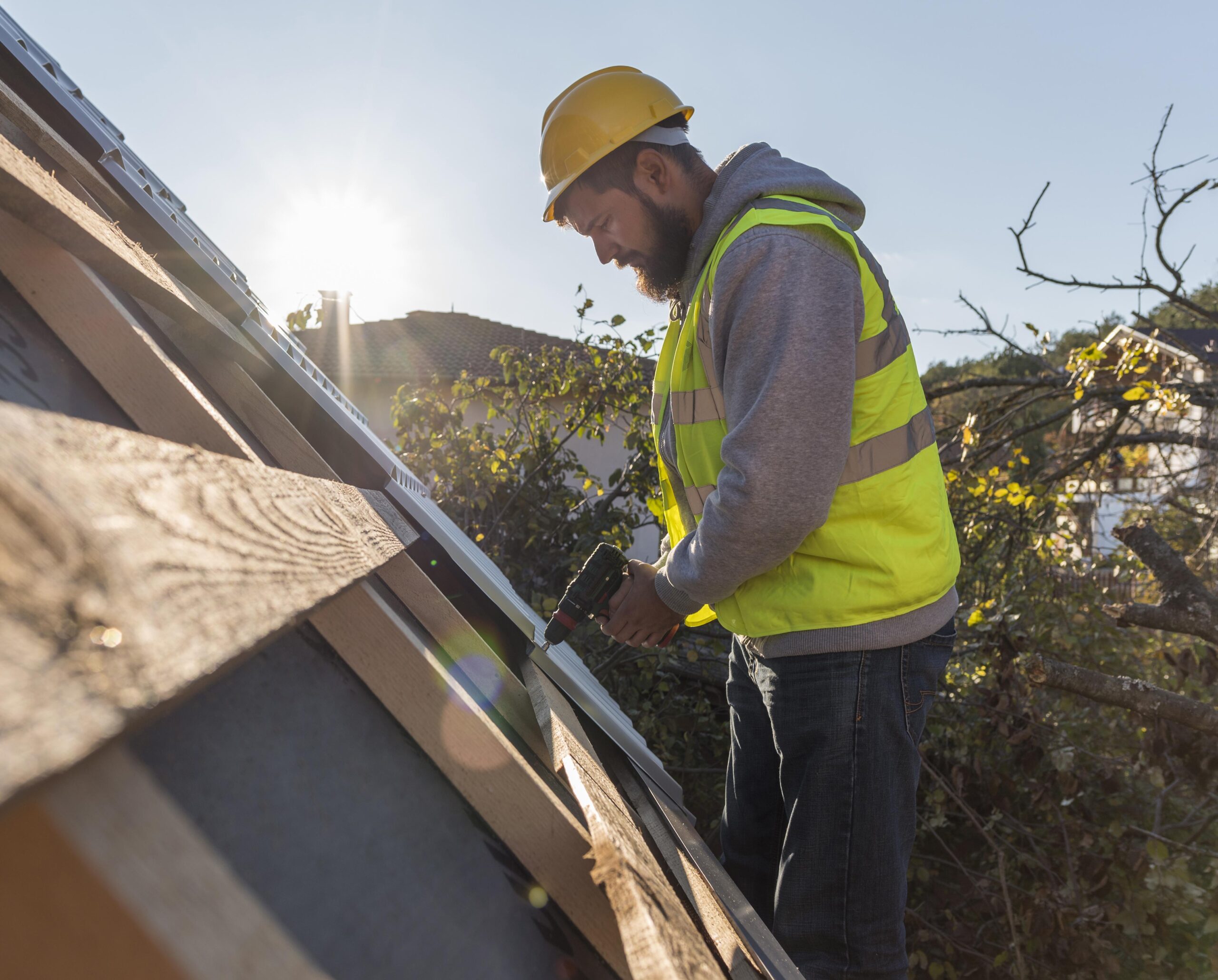 A roofer performs emergency repairs with expert precision.