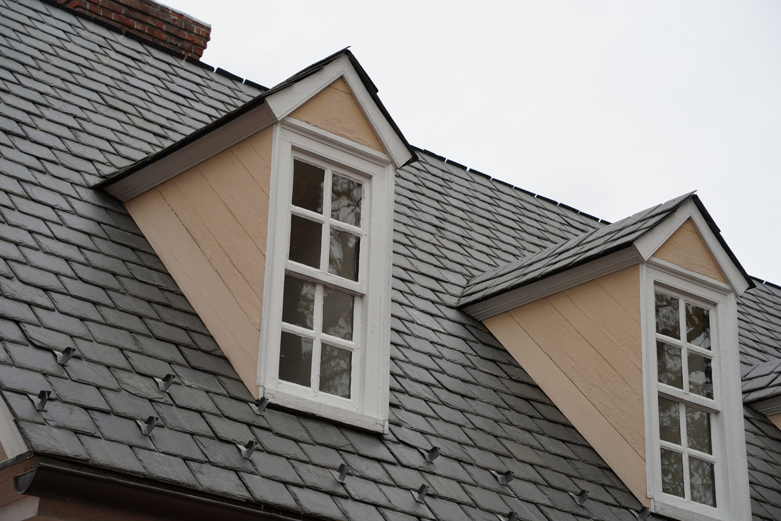 New reddish-brown asphalt shingles on a residential building in Eastern Oklahoma.