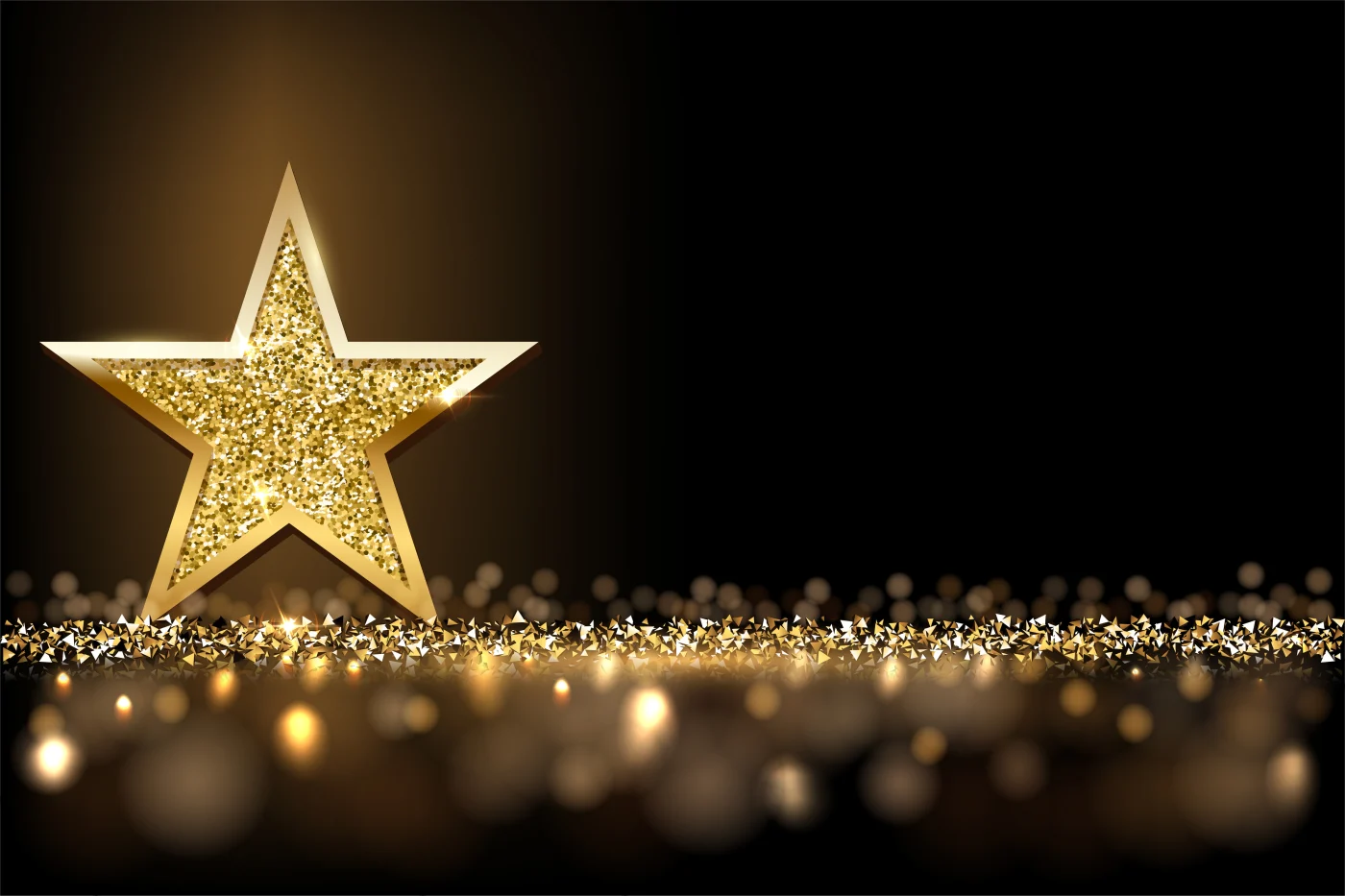 A gold star surrounded by a black background
