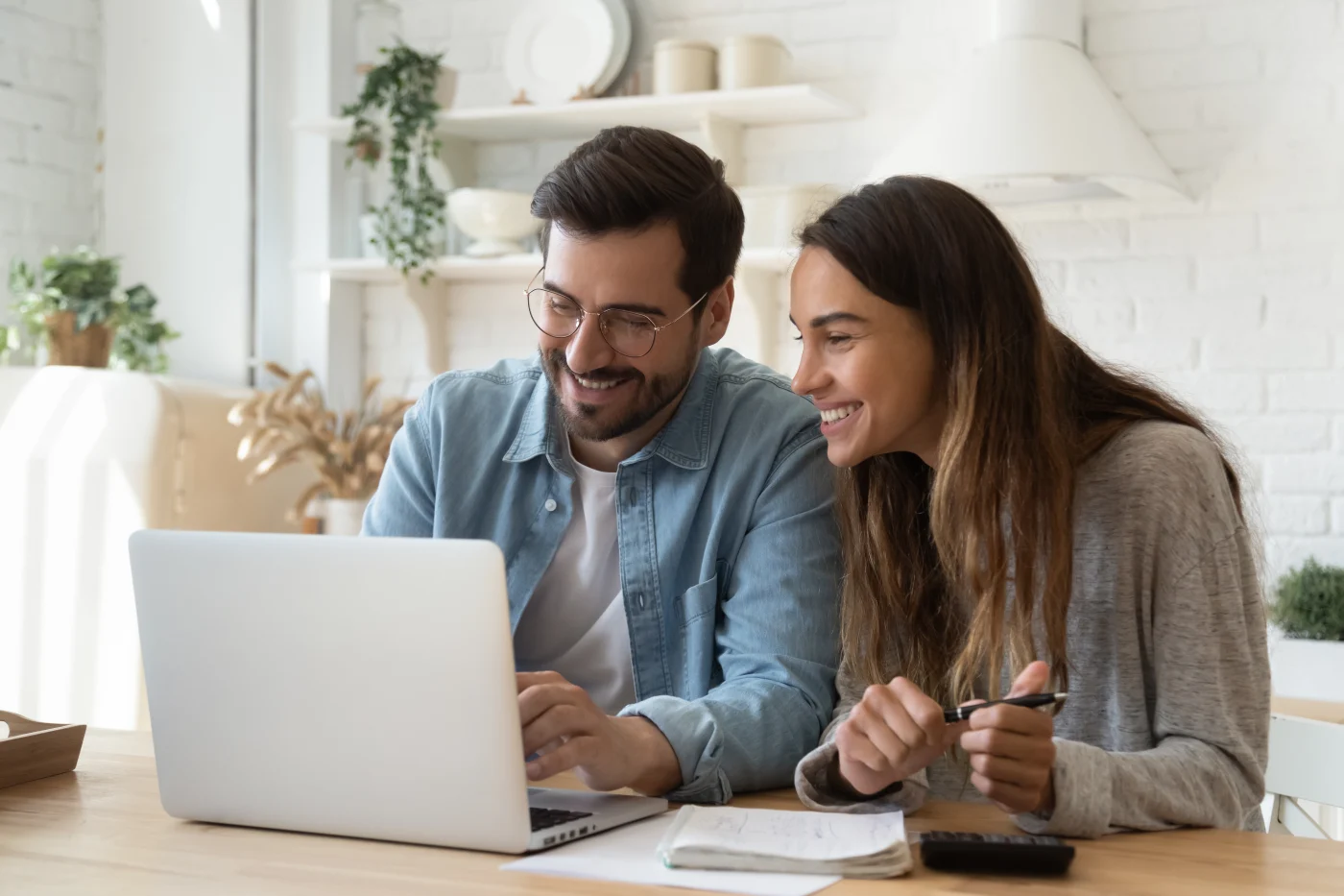 Financing | Roofing Services In Tulsa, OK | GoldenRite Roofing A young couple looks at financing opportunities online