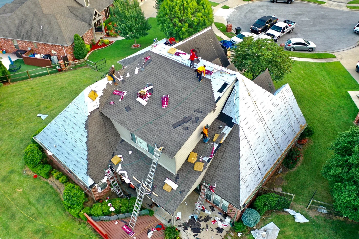 Hard-working roofing professionals install a brand-new roof