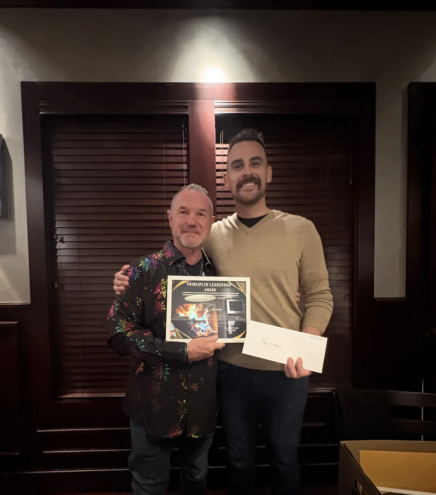 GoldenRite Roofing presents awards during a company dinner