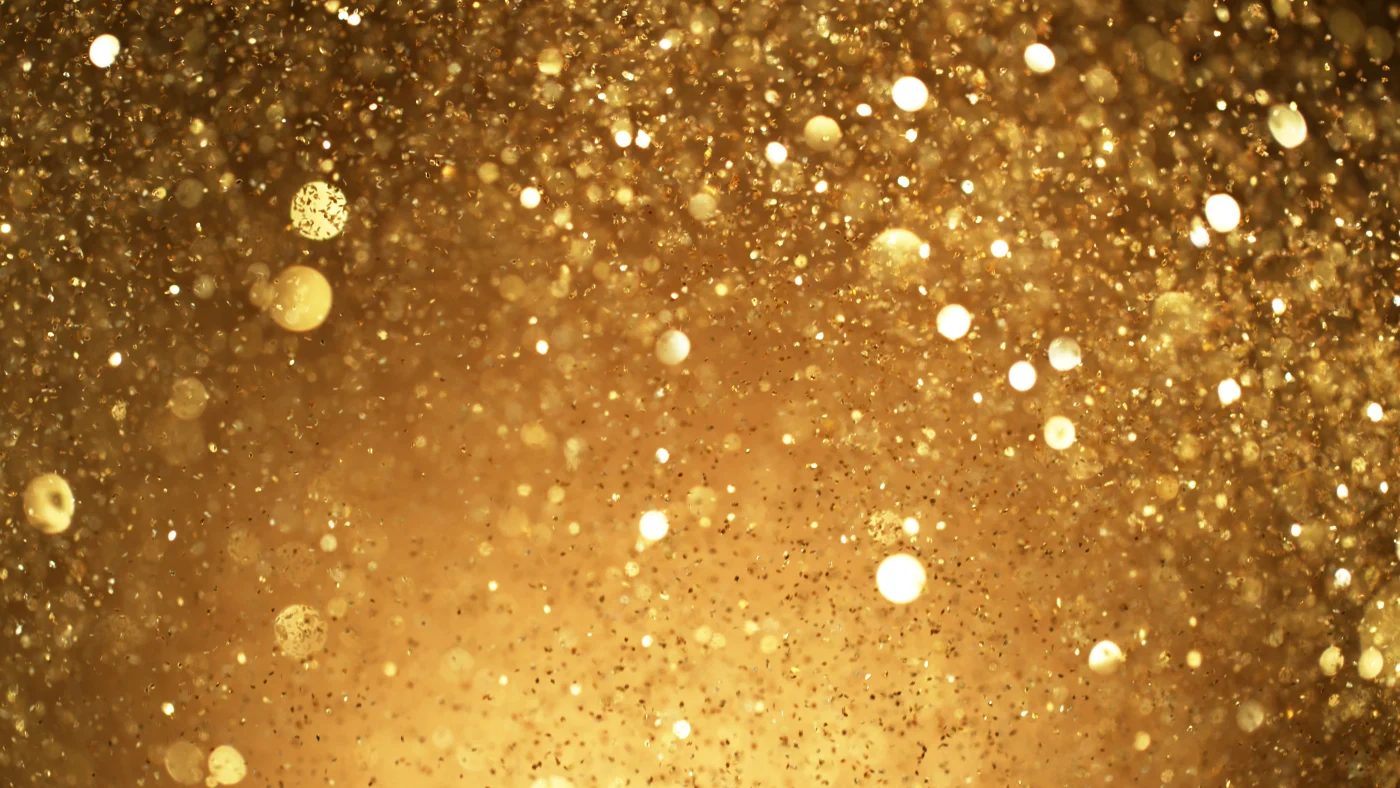 Abstract Golden Glittering Background With Blur Dots.